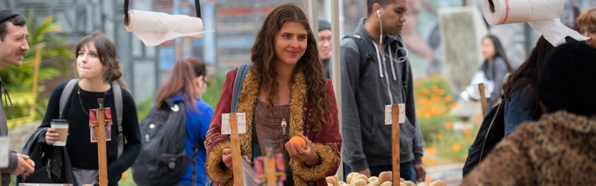 a student shopping at the farmers market.